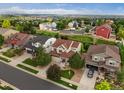 Scenic aerial view of a neighborhood showcasing well-manicured lawns and diverse home styles at 11945 S Saunter Ln, Parker, CO 80138