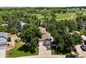 A charming property showcases a lush green lawn and a convenient three-car garage at 3043 W 109Th Pl, Westminster, CO 80031