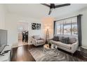 Comfortable living room with a cozy seating area, hardwood floors and natural light at 5295 Perry St, Denver, CO 80212