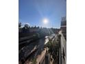 Bright view of a flowing river from a modern balcony on a sunny day at 1438 Little Raven St # 306, Denver, CO 80202