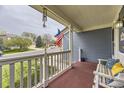 View from the cozy front porch with a bench and view of the neighborhood at 10987 Cannonade Dr, Parker, CO 80138