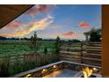 Outdoor fire pit area overlooking a scenic landscape, creating a serene and inviting atmosphere at 740 Meadowlark Dr, Erie, CO 80516