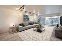 Cozy living room with plush seating and a balcony overlooking the city at 888 N Logan St # 4A, Denver, CO 80203