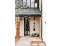 An open concept front entrance with a slate walkway and a modern doorframe at 1921 W 37Th Ave, Denver, CO 80211