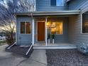 Inviting front porch with stylish plants, a charming orange door, and well-kept surroundings at 500 Lashley St # 58, Longmont, CO 80504