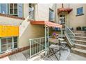 Cozy patio area with seating, perfect for relaxing, outside units 9, 10, and 11 at 485 S Logan St # 10, Denver, CO 80209