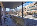 Cozy covered patio area with seating, perfect for relaxing outdoors at 2044 N High St, Denver, CO 80205