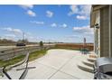 Spacious backyard featuring a concrete patio, grill, and comfortable hammock setup at 2201 Monte Vista St, Fort Lupton, CO 80621