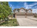 Charming two-story townhome with a two-car garage, lovely yard and stone accents at 5957 Turnstone Pl, Castle Rock, CO 80104
