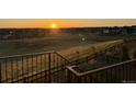 Stunning backyard view with a dark fence and steps, perfect for relaxation at 8784 S Riviera Ct, Aurora, CO 80016