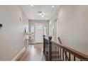 Bright entryway features a hardwood floor, neutral colors, and natural light at 8784 S Riviera Ct, Aurora, CO 80016