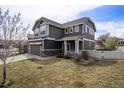 Well-maintained two-story home featuring a neatly landscaped yard, attached garage, and inviting curb appeal at 4307 Beautiful Cir, Castle Rock, CO 80109