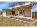 Charming two-story home with covered porch, brick facade, bay window, and a manicured front yard at 9749 Meade Cir, Westminster, CO 80031