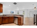 Modern kitchen with stainless steel appliances, breakfast bar, and light wood flooring at 11935 Riverstone Cir # 6D, Henderson, CO 80640