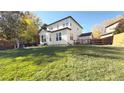 Landscaped backyard with a pergola and patio at 16355 Flintlock Ct, Parker, CO 80134