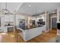 Spacious kitchen with island, granite countertops, and stainless steel appliances at 16355 Flintlock Ct, Parker, CO 80134