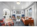 Bright living room with fireplace and comfortable seating at 2236 Jasmine St, Denver, CO 80207