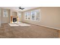 Spacious living room featuring a fireplace and ample natural light at 3272 Brushwood Dr, Castle Rock, CO 80109