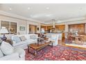 Inviting living room featuring plush seating, stylish decor, and open access to the kitchen area at 2200 S University Blvd # 514, Denver, CO 80210
