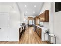 Modern kitchen with stainless steel appliances and hardwood floors at 5454 Clay St, Denver, CO 80221