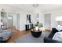 Bright living room with hardwood floors, modern furniture, and ample natural light at 3640 Elm St, Denver, CO 80207