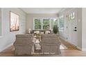 Bright living room featuring large windows and neutral decor at 2709 S Franklin St, Denver, CO 80210