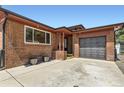 Charming brick home with a spacious driveway and attached garage at 8375 W 17Th Ave, Lakewood, CO 80214