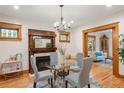 Elegant dining area with hardwood floors, fireplace, and access to living room at 2845 N Vine St, Denver, CO 80205