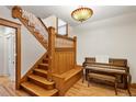 Grand wooden staircase with intricate details and built-in seating at 2845 N Vine St, Denver, CO 80205
