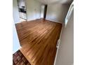 Bright living room features gleaming hardwood floors and fresh neutral paint at 2991 S Whiting Way, Denver, CO 80231