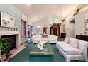 Bright living room showcasing a fireplace, plush seating, and elegant décor at 7500 E Dartmouth Ave # 16, Denver, CO 80231