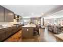 Modern kitchen featuring a large center island, granite countertops, and stainless steel appliances at 290 Dexter St, Denver, CO 80220