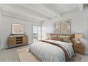 Cozy bedroom featuring neutral tones, soft lighting, and comfortable bedding at 7865 E Mississippi Ave # 1502, Denver, CO 80247