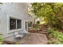 Relaxing back patio area with outdoor seating and steps leading to the garden at 8888 W 37Th Pl, Wheat Ridge, CO 80033