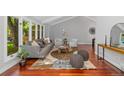 Bright and stylish living room with vaulted ceilings, cozy seating, and hardwood floors at 9951 Winona St, Westminster, CO 80031