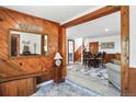 Inviting entryway with wood paneling, stylish decor, and seamless access to the home's living areas at 63 Sillasen Ln, Golden, CO 80403