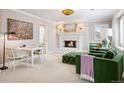 Cozy sitting room offers a fireplace and neutral paint at 6375 E Tufts Ave, Englewood, CO 80111