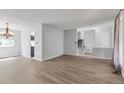 Spacious living room offering stylish floors and ample space for relaxation and entertaining at 1005 S Lewiston Way, Aurora, CO 80017