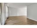 Bright living room featuring stylish flooring and lots of natural light at 1005 S Lewiston Way, Aurora, CO 80017