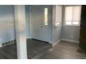 Bright entryway with a stained-glass window and grey laminate flooring at 2678 S Xanadu Way # C, Aurora, CO 80014