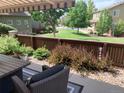Outdoor patio area with comfortable seating and scenic views of the landscaped yard at 10634 Ashfield St, Highlands Ranch, CO 80126