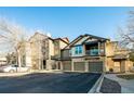 Exterior view of townhome showing parking, balcony, and surrounding landscape at 7432 S Quail Cir # 1818, Littleton, CO 80127
