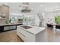 Bright, modern kitchen with a large island, stainless steel appliances, and an open floor plan perfect for entertaining at 1711 Boulder St, Denver, CO 80211
