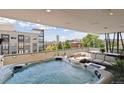Relax on this condo's fantastic patio with a large hot tub and comfortable outdoor furniture at 1711 Boulder St, Denver, CO 80211