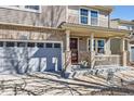 Inviting front porch with stylish pillars, a cozy bench, and a welcoming entrance at 1824 Morningview Ln, Castle Rock, CO 80109