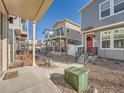 A neighborhood street view showcasing modern homes, well-kept yards, and convenient walkway access at 4987 N Walden Way, Denver, CO 80249