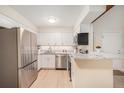 Open kitchen features stainless steel appliances, granite countertops and ample cabinet space at 10251 W 44Th Ave # 3-204, Wheat Ridge, CO 80033