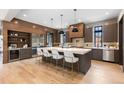 Spacious kitchen with a large island, modern appliances, and stylish pendant lighting at 1100 S Elizabeth St, Denver, CO 80210