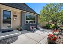 Inviting front porch with seating area perfect for relaxing outdoors at 6868 S Birch Way, Centennial, CO 80122