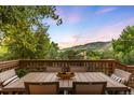 Outdoor dining area with mountain view, featuring a table and chairs, perfect for entertaining at 600 Cascade Dr, Golden, CO 80403